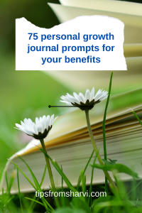 Book on green grass with white flowers. Text: 75 personal growth journal prompts for your benefits, tipsfromsharvi.com.